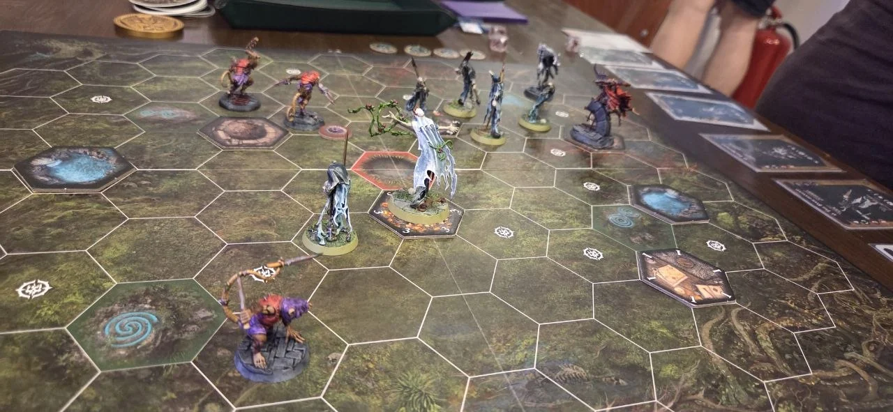 Painted Warhammer Underworlds miniatures in action on a game board at Siren Games